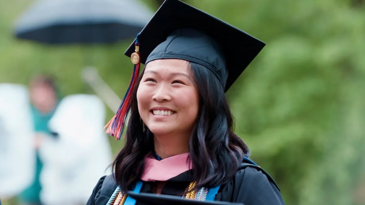 A picture of a graduate smiling.