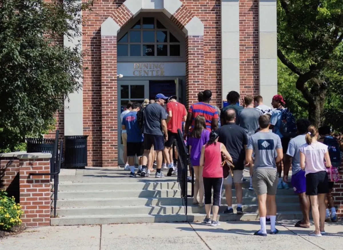 A group of people entering the dining center
