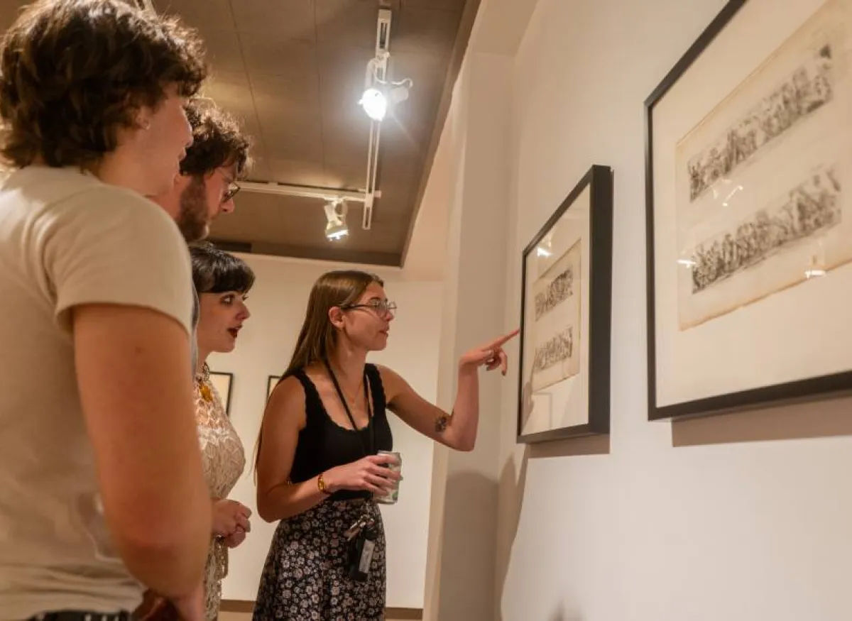 students examine exhibit