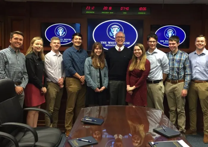 Students standing inside a White House room