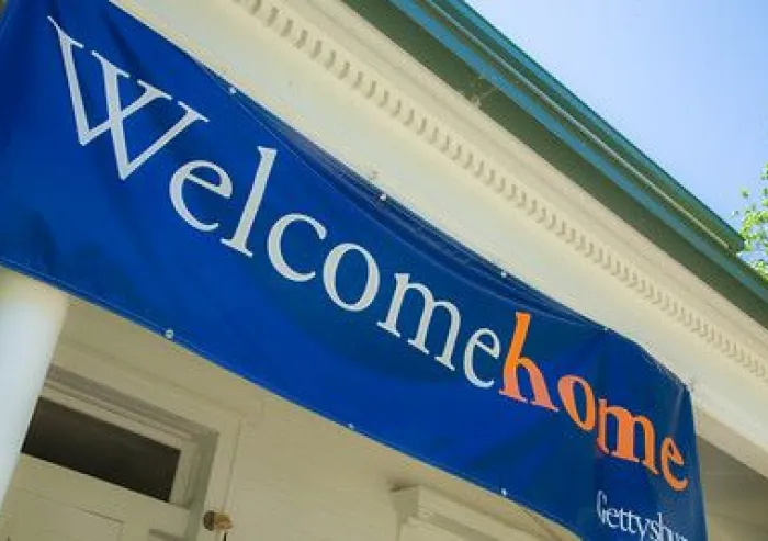 A floating banner with " Welcome Home" written on it