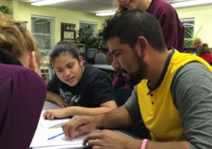 Students provide ESL instruction.