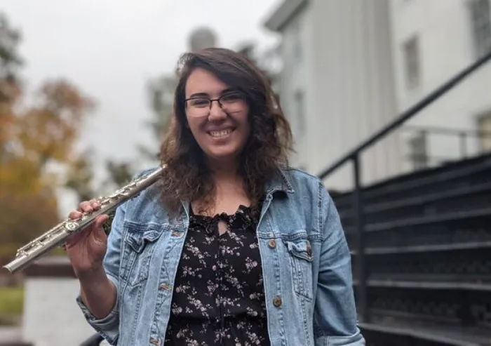 Student holding a flute