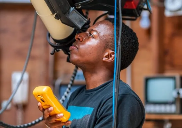 Student using a telescope