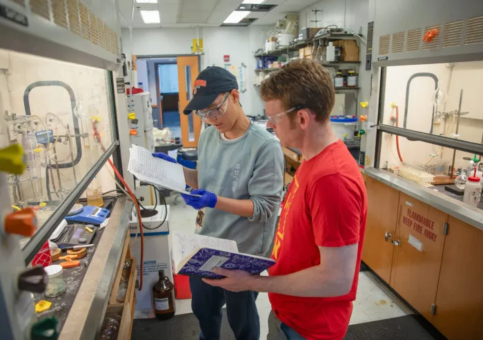 student and prof in chem lab