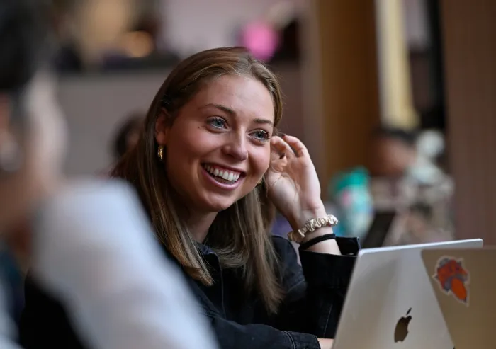 student sitting and smiling
