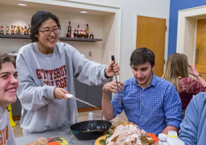 A group of students share a meal.