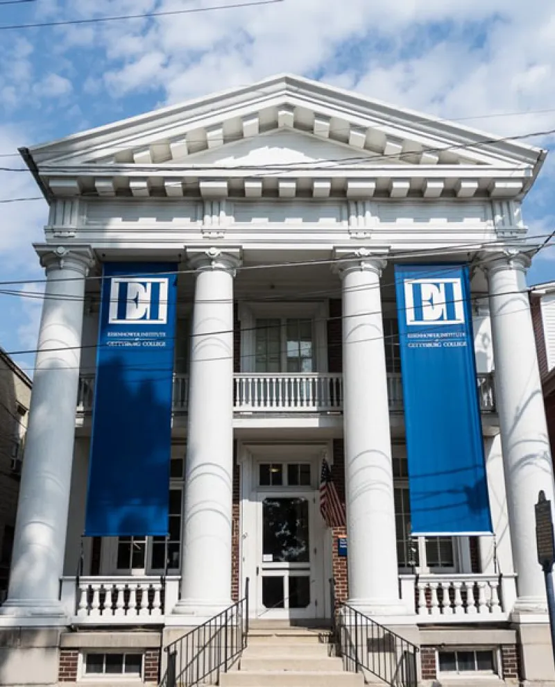 Photo of the front of the Eisenhower Institute with its blue banners