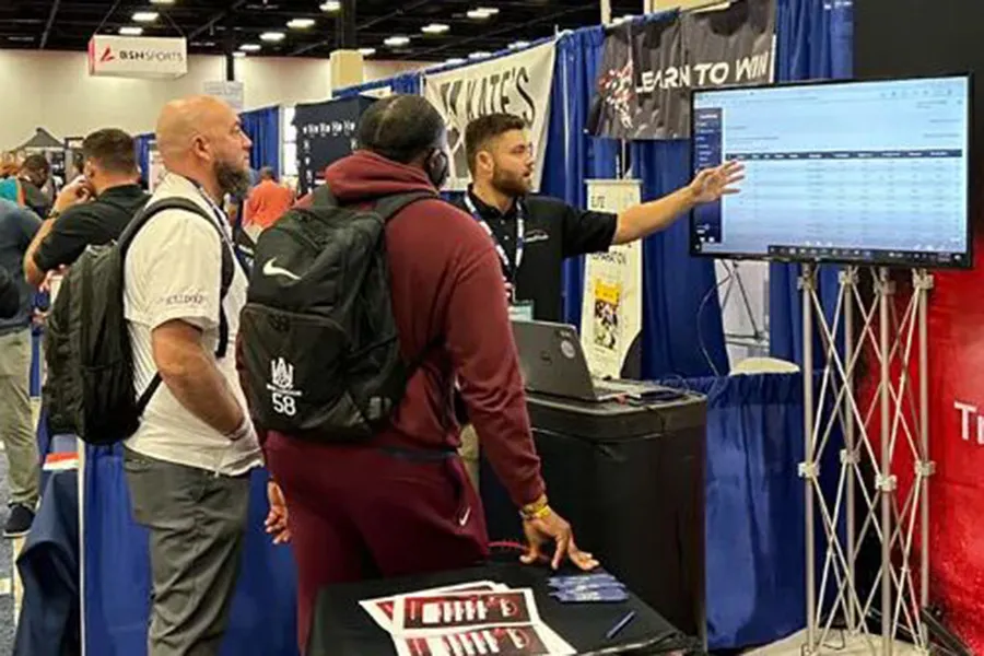 expo exhibit rep talking to attendees