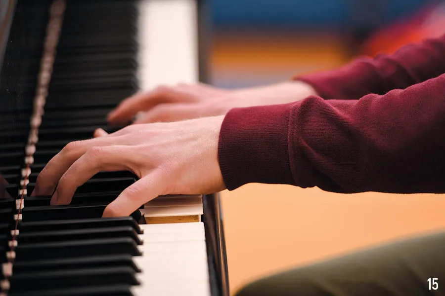 fingers on piano keys