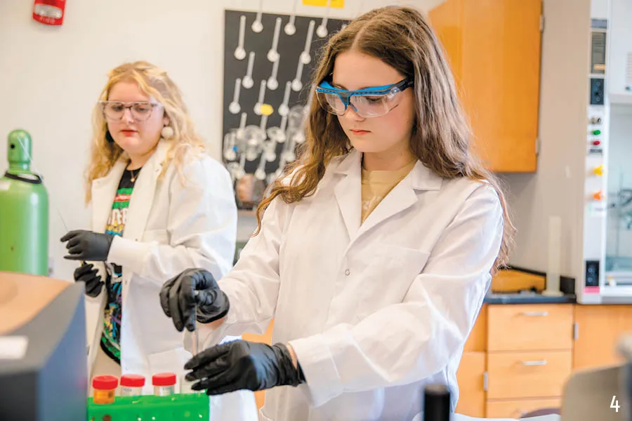 students in chemistry lab pipetting