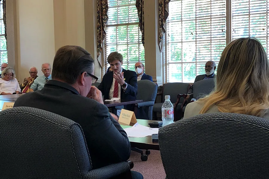student speaking to panel