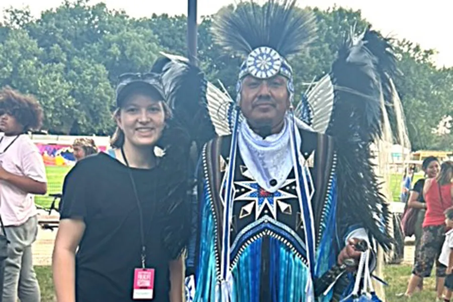  Szczepkowicz with a member of the Native American dance troupe Indigenous Enterprise