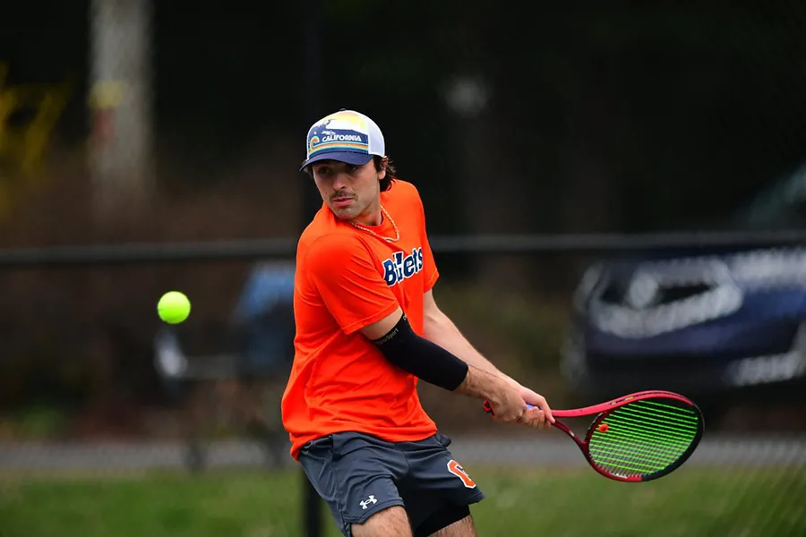  Michael Fellman ’25 playing tennis