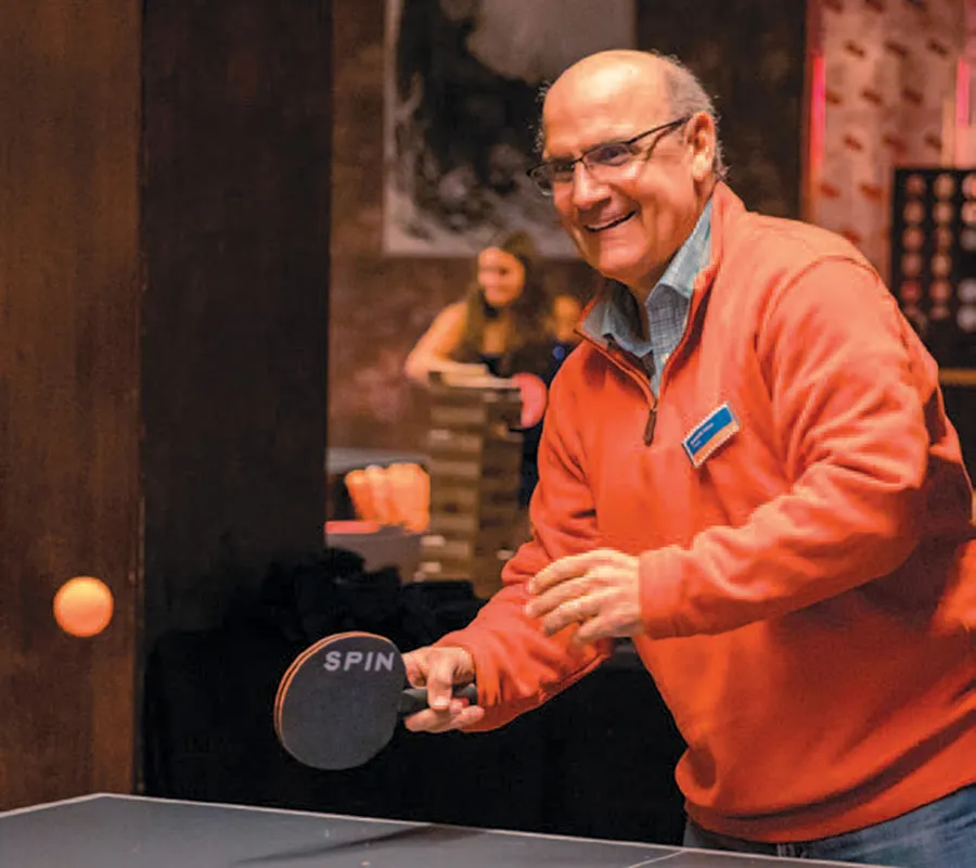 President Iuliano plays table tennis