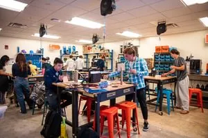 Students working on class projects inside the innovation center.