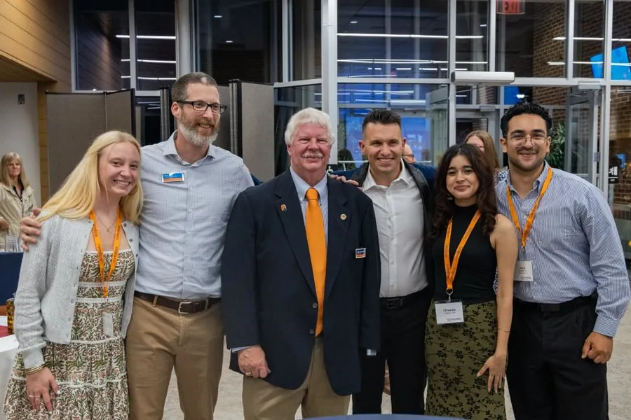 Staff and students stand with GLC founder Bob Garthwait, Jr. ’82.