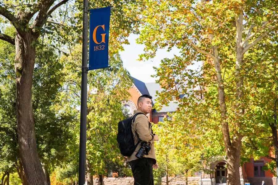 Eric Lee ’15 scouts the Gettysburg College campus scene for photo inspiration in September 2025.