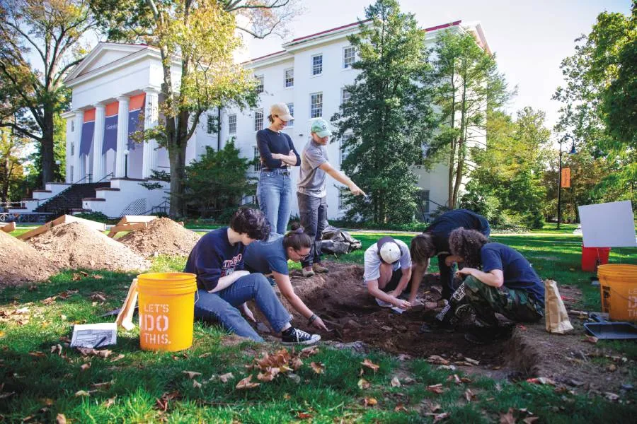 Students participate in on-campus archaeological digs for hands-on experience. 