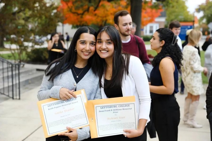 Bishruti Rijal ’26 and Saleha Iftikhar ’26 celebrate their academic recognitions during Fall Honors Day in October 2025.
