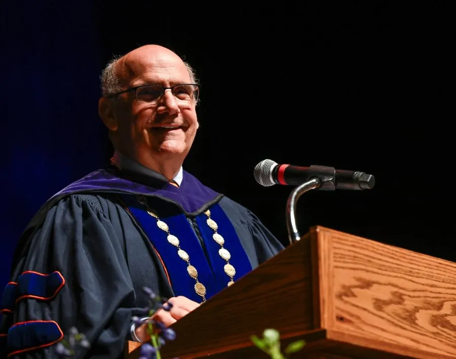 Gettysburg College President Bob Iuliano addresses the master’s graduates inside the Majestic Theater.
