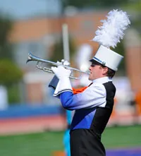 Bullets marching band member plays trumpet.