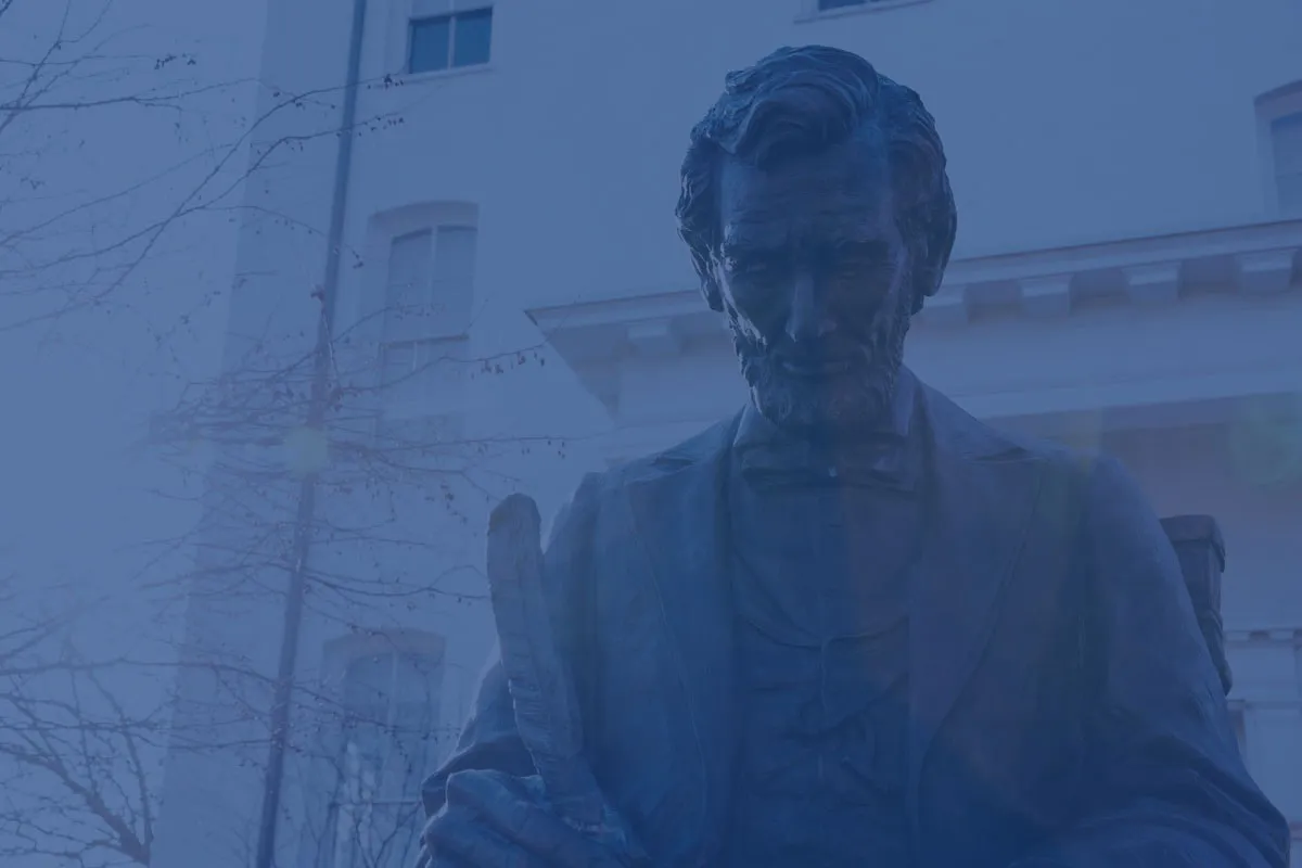 A photo of a statue of Abraham Lincoln with a blue filter on it.
