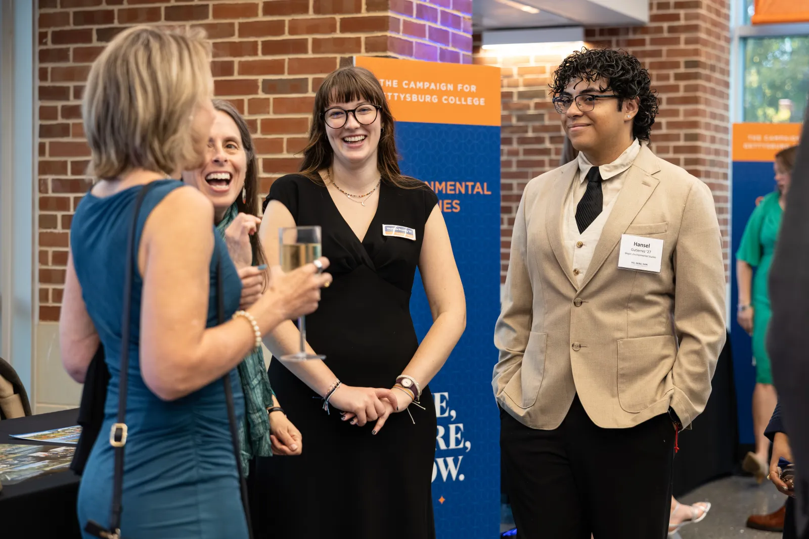 Gettysburg students and faculty from the Environmental Studies Department discuss their research and career goals with alumni and friends prior to the campaign reception (Photo by Tyler Caruso). 