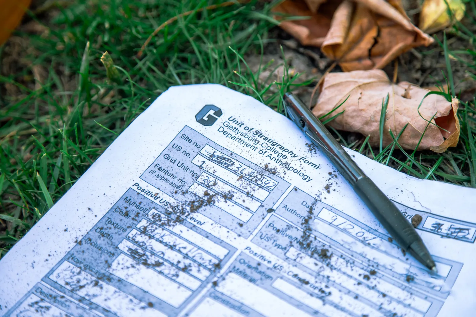 pen and paper form for archaeological finding