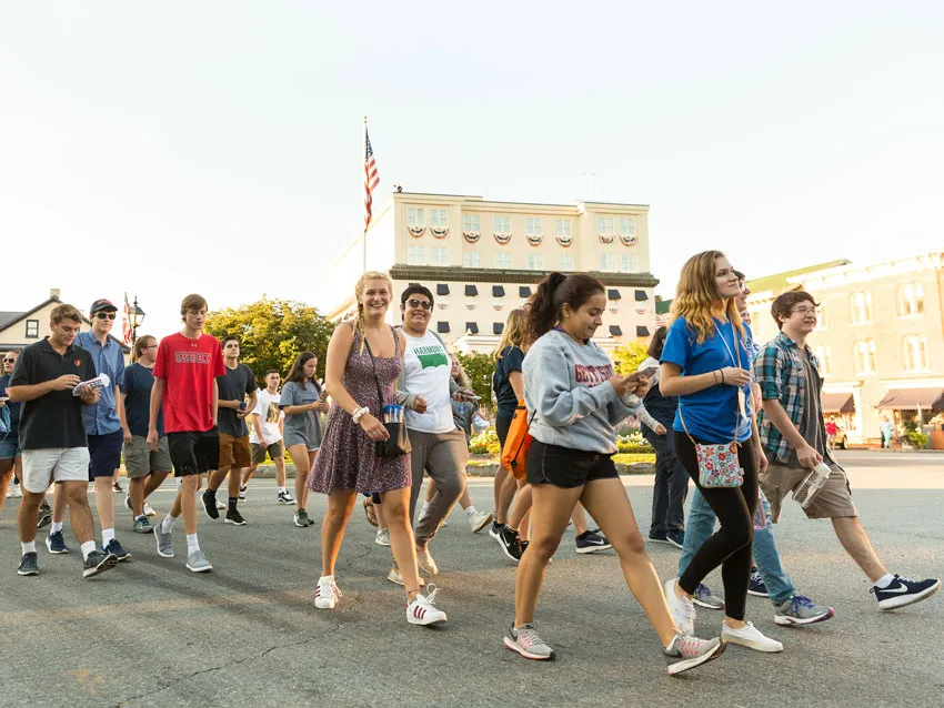 Students walk down the street during the first-year walk.