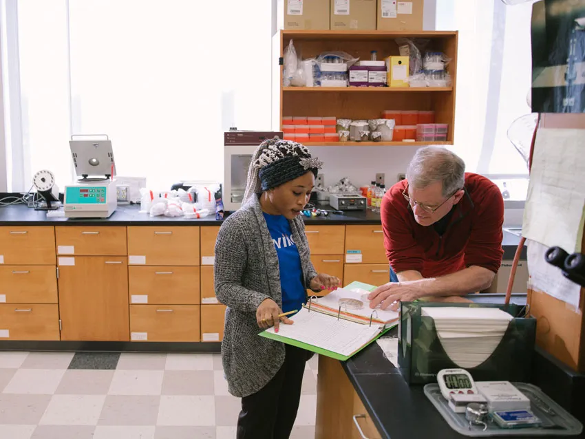 A student and teacher have a discussion.