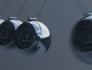 A photo of a Newton's cradle.