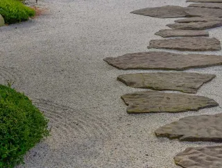 Stone path through a gravel garden.