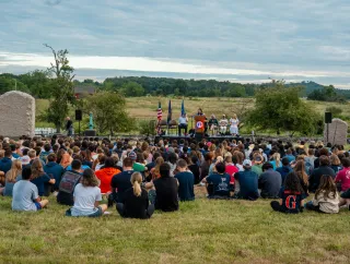 Students sitting in field