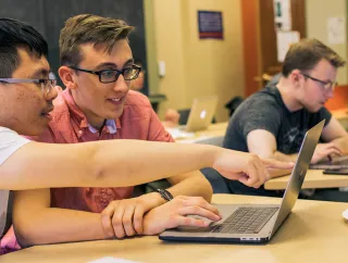 Students working in a classroom.