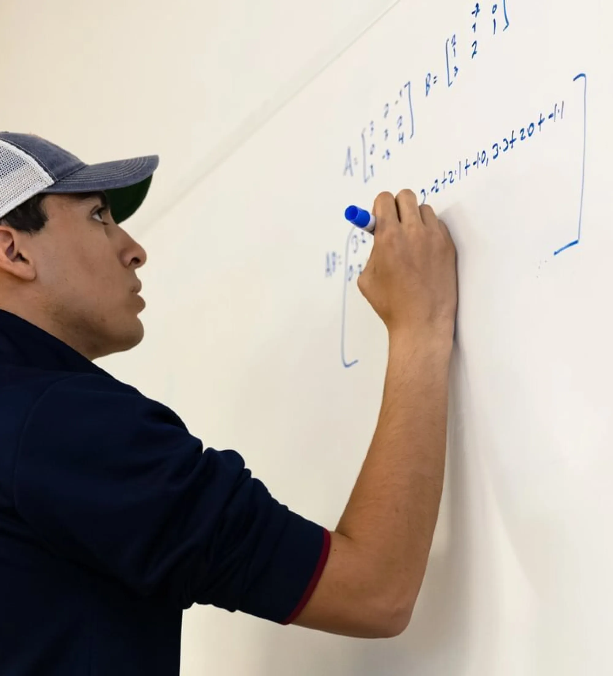 student at whiteboard