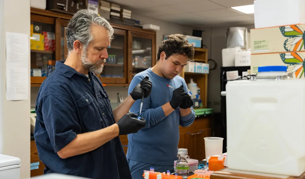 prof and student pipetting