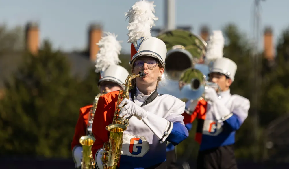 marching band brass section at the stadium