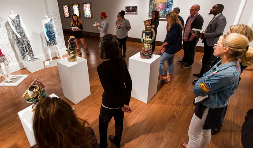attendees at student exhibit opening