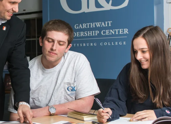 Students work together at a table in the Garthwait Leadership Center.