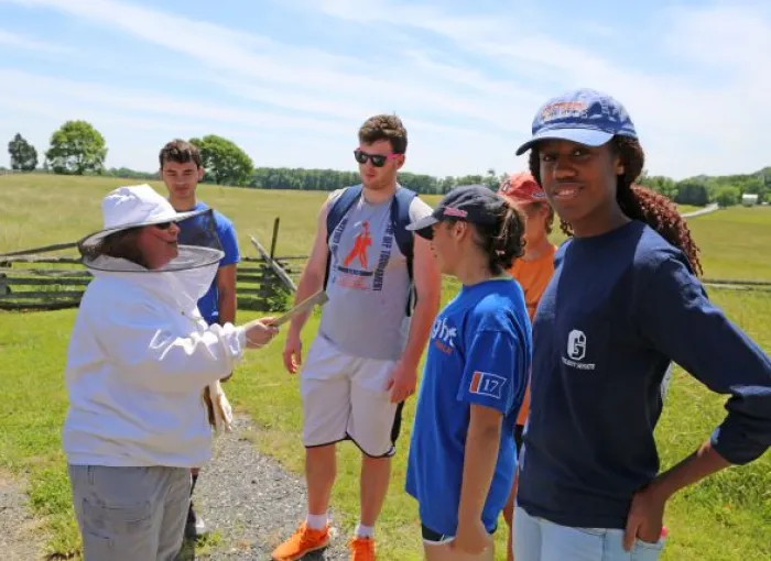 Students receive beekeeping instruction at Sherfy Garden.