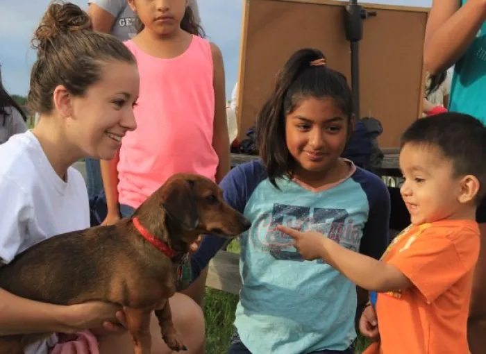 Students introduce pets to community members.
