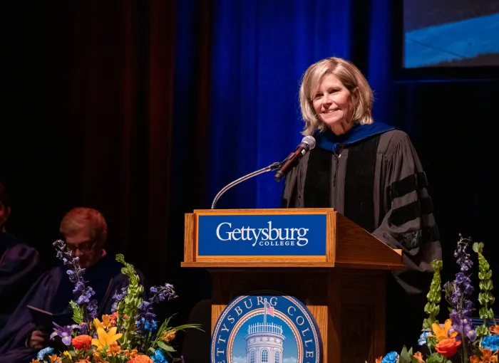 speaker at podium in regalia