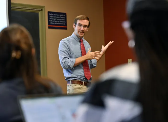 prof teaches at front of class