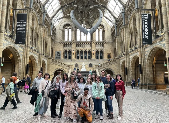 Students gather for group shot in London museum