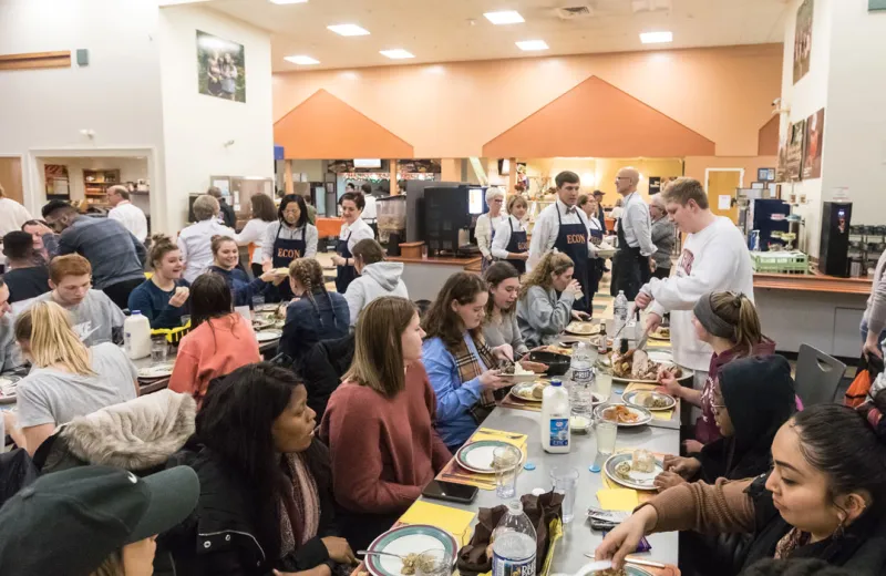 A group of people gather to enjoy a meal together 