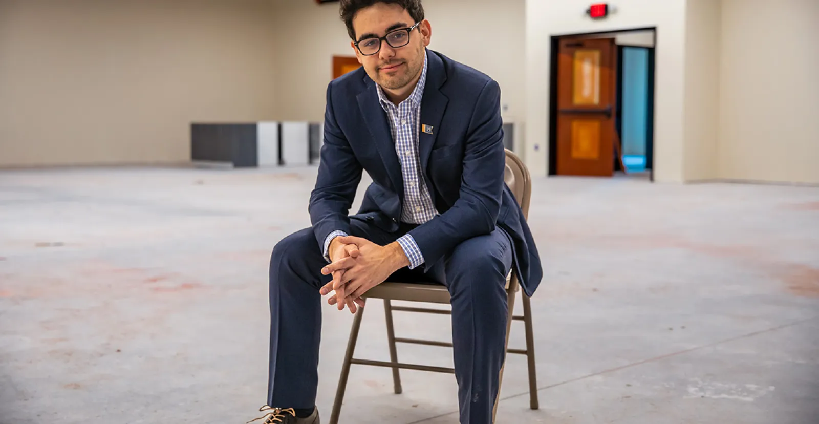 Adams County Historical Society Executive Director Andrew Dalton ’19 sits in a room
