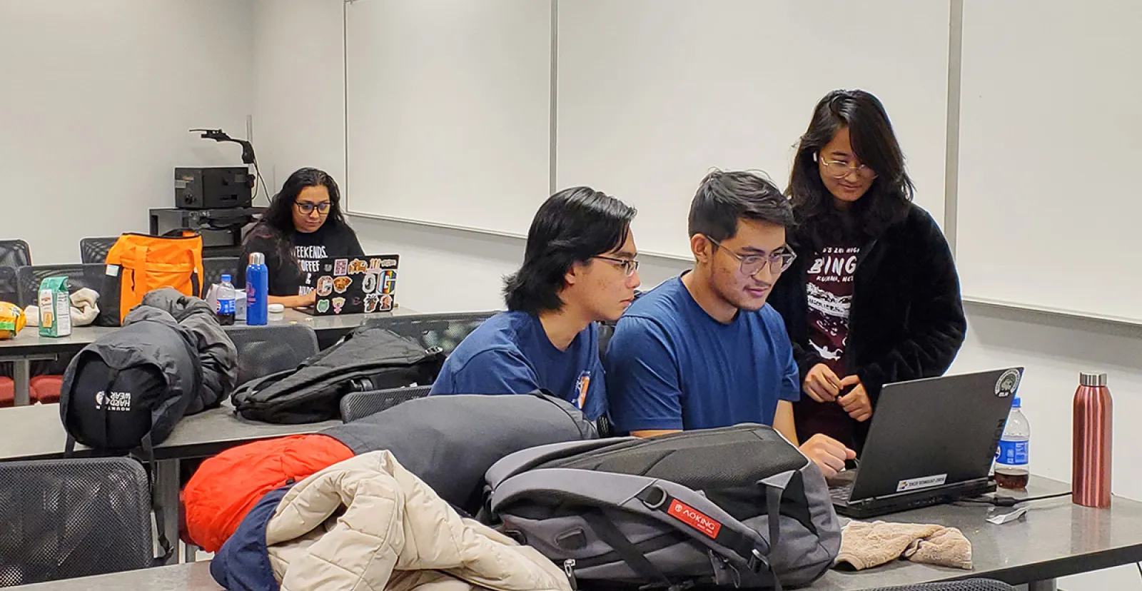 Thuc Duy Tran ’27, Sanij Shrestha ’26, and Yashaswe Amatya ’26, along with Thuc Duy Tran ’27 work on a project