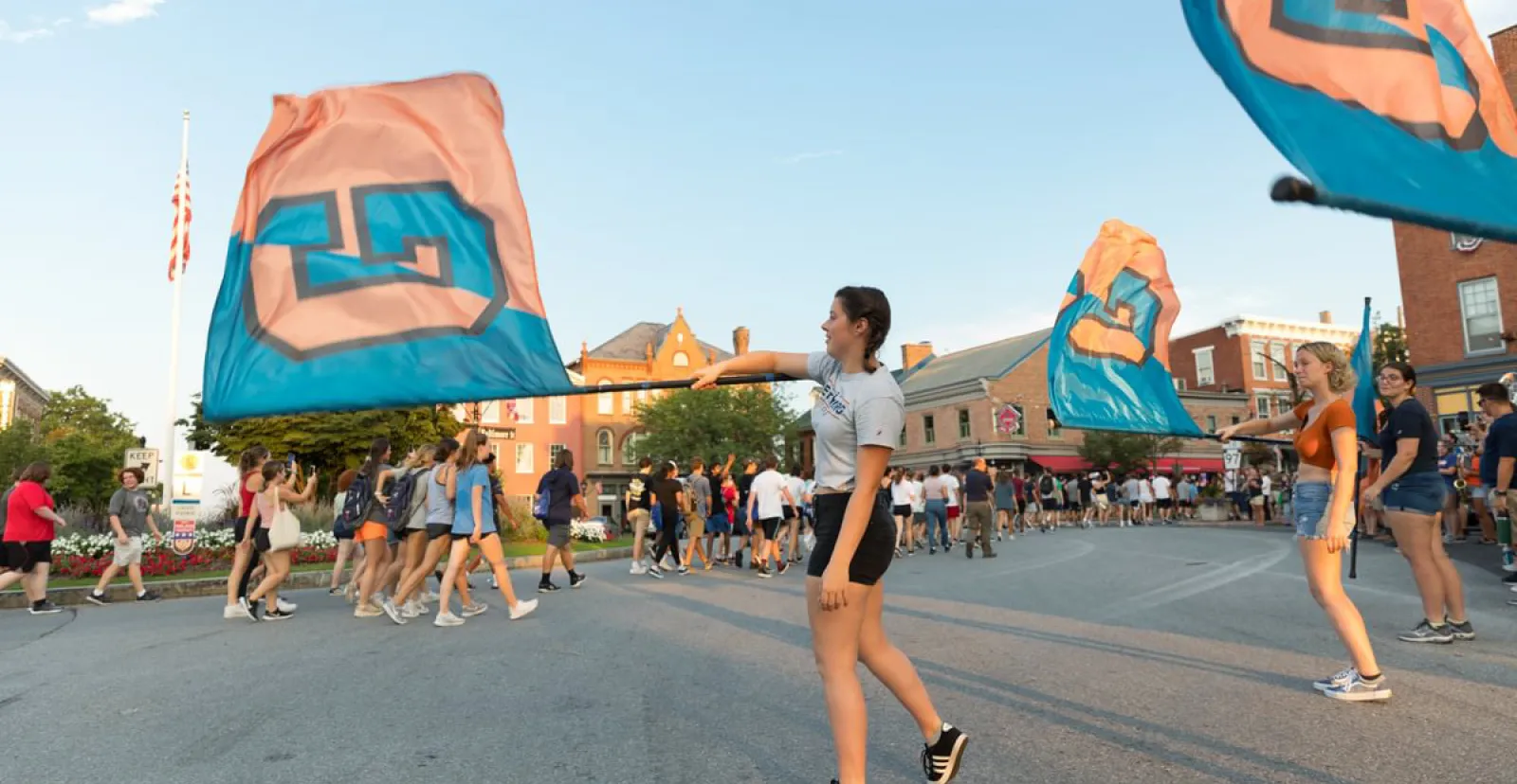 An image of flag bearers waving Gettysburg banners