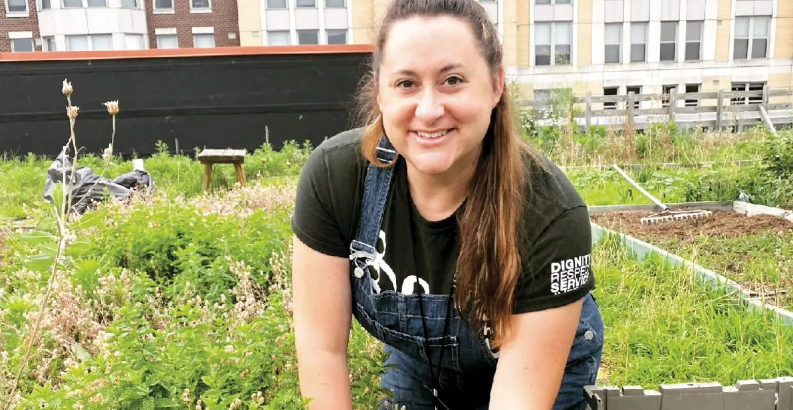 Ashley Domm ’07 works in Bread for the City’s rooftop garden.